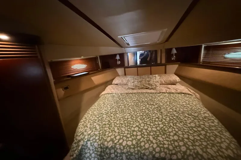  Yacht Photos Pics Luxurious bedroom interior of 2005 Sea Ray 500 Sedan Bridge yacht.