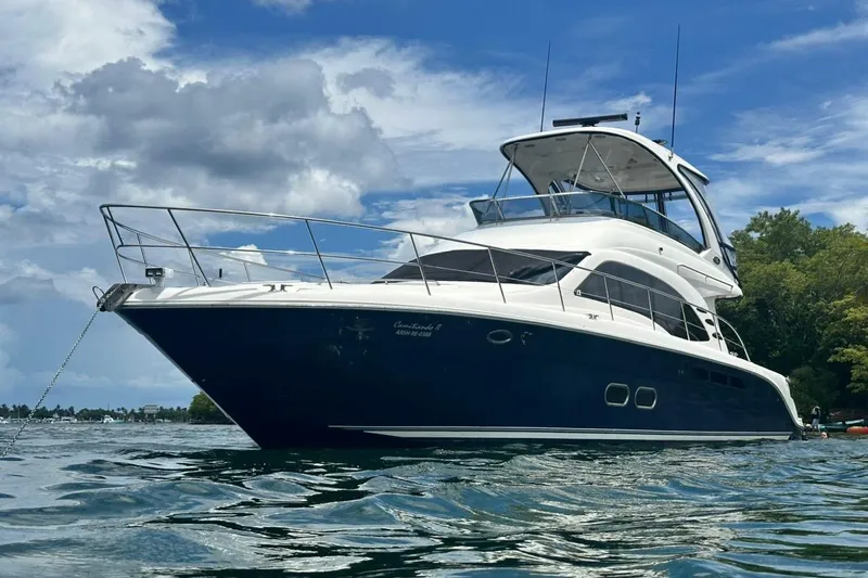  Yacht Photos Pics 2005 Sea Ray 500 Sedan Bridge yacht anchored on a sunny day.