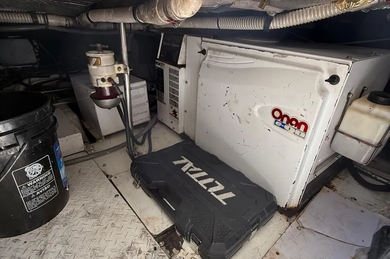  Yacht Photos Pics Engine room of 2005 Sea Ray 500 Sedan Bridge with Onan generator and tools.