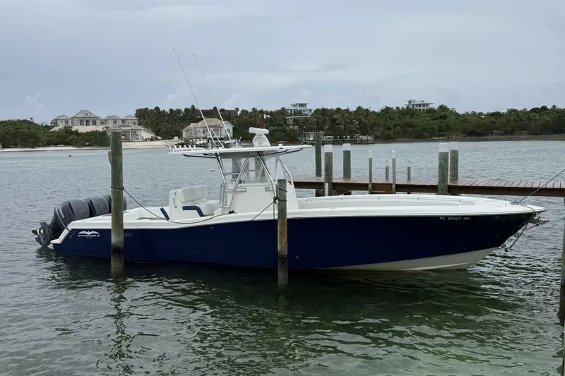 Sindylou Yacht Photos Pics 2012 Invincible 36 Open Fisherman boat docked in calm waters.
