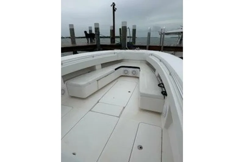 Sindylou Yacht Photos Pics 2012 Invincible 36 Open Fisherman boat interior with white seating and storage compartments.