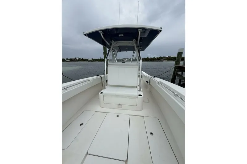 Sindylou Yacht Photos Pics 2012 Invincible 36 Open Fisherman boat with spacious deck and seating, docked by the water.