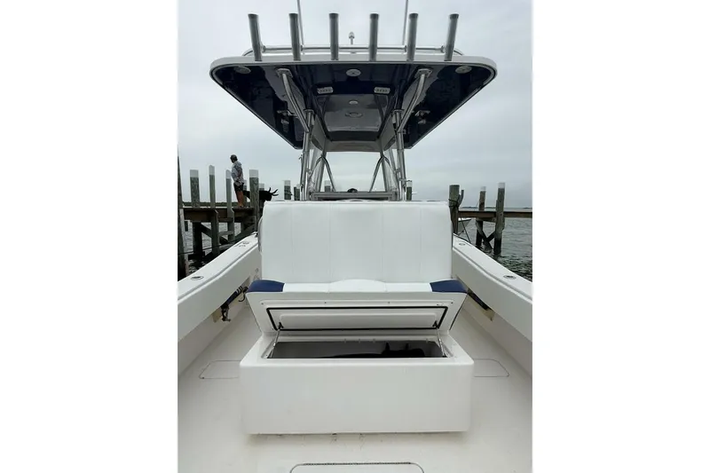 Sindylou Yacht Photos Pics 2012 Invincible 36 Open Fisherman boat with open storage compartment, dockside view.