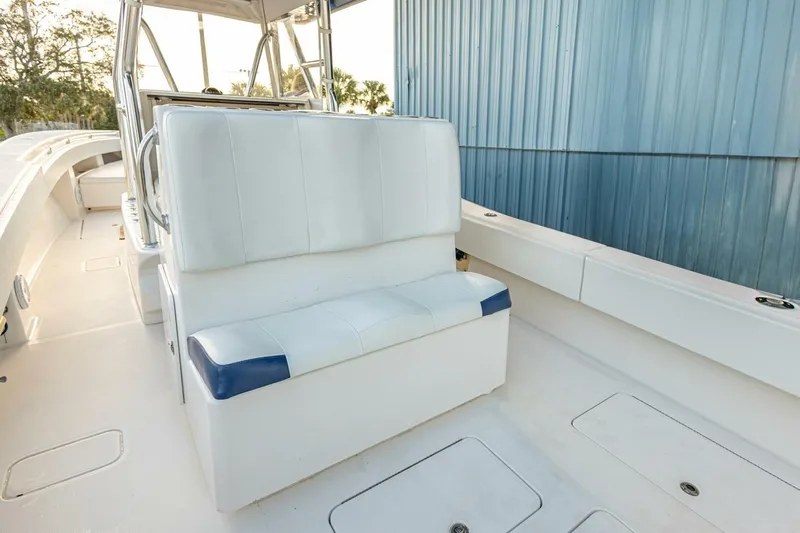 Sindylou Yacht Photos Pics 2012 Invincible 36 Open Fisherman boat interior with white seating and blue accents.