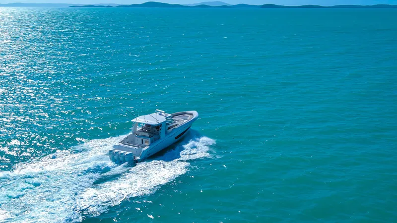  Yacht Photos Pics 2017 Boston Whaler 420 Outrage cruising on open blue ocean waters.