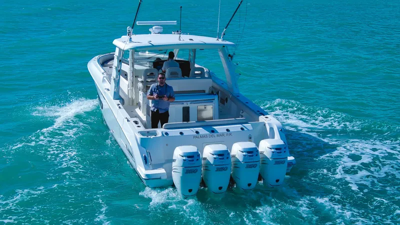  Yacht Photos Pics 2017 Boston Whaler 420 Outrage cruising on clear blue water.