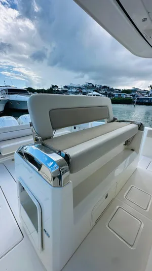  Yacht Photos Pics 2017 Boston Whaler 420 Outrage boat interior with seating, docked by the water.