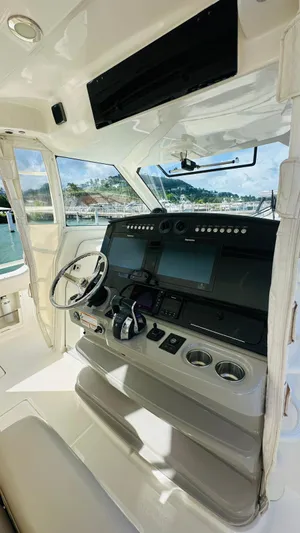  Yacht Photos Pics 2017 Boston Whaler 420 Outrage helm with modern controls and navigation systems.
