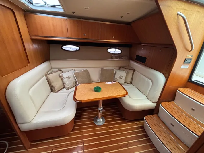 Yacht Photos Pics 2008 Tiara Yachts 3600 Open interior with cozy seating and wooden accents.