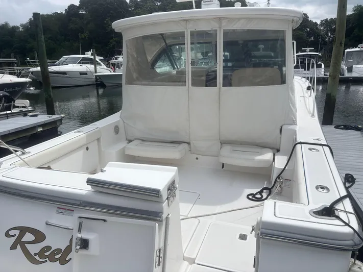  Yacht Photos Pics 2008 Tiara Yachts 3600 Open docked, featuring spacious deck and seating area.