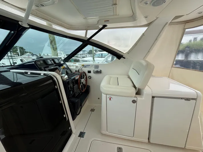  Yacht Photos Pics 2008 Tiara Yachts 3600 Open helm with white seating and control panel.