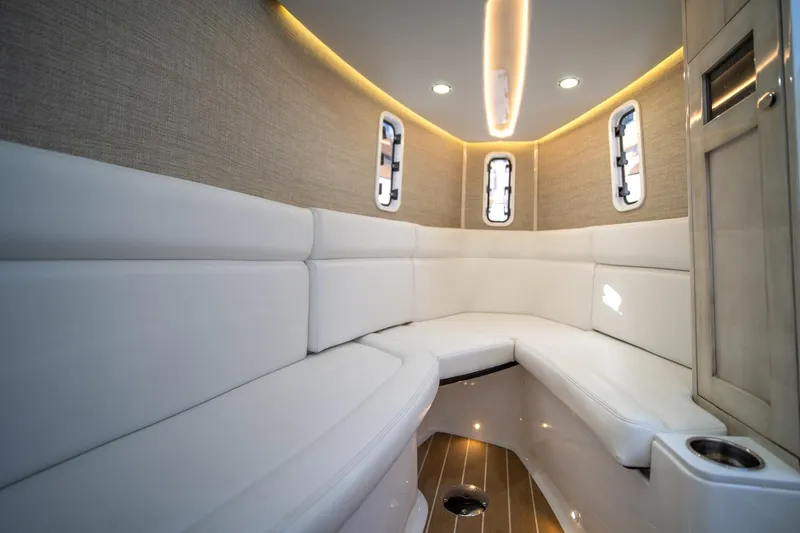 Sun Owl Yacht Photos Pics Luxurious interior of 2020 HCB 42 Lujo boat with white seating and ambient lighting.