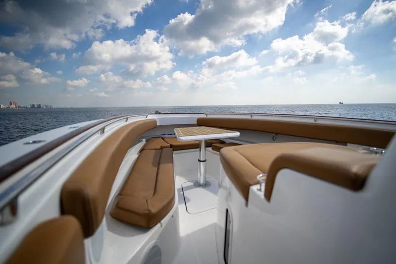 Sun Owl Yacht Photos Pics 2020 HCB 42 Lujo boat with tan seating, ocean view, and cloudy sky.
