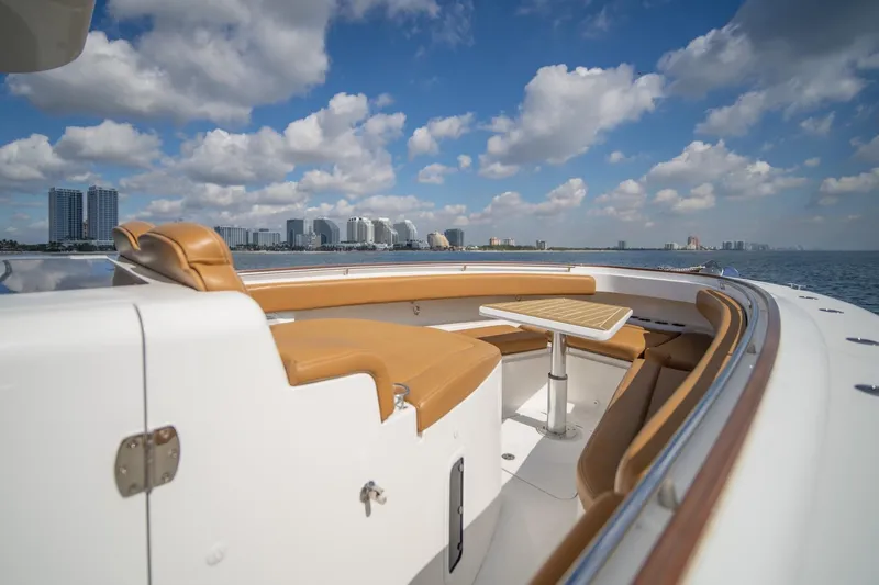 Sun Owl Yacht Photos Pics 2020 HCB 42 Lujo yacht with tan seating, ocean view, and city skyline.