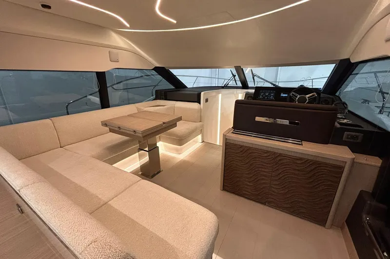  Yacht Photos Pics Luxurious interior of 2026 Prestige F4.9 yacht with modern seating and helm station.