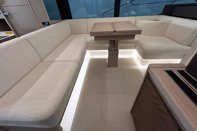  Yacht Photos Pics Luxurious interior of 2026 Prestige F4.9 yacht with elegant seating and modern table design.