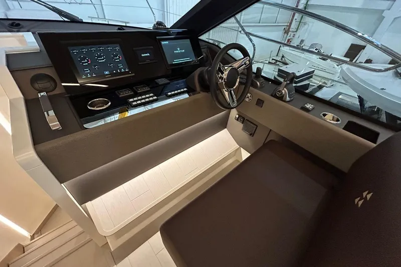  Yacht Photos Pics Modern helm of 2026 Prestige F4.9 yacht with advanced navigation displays.