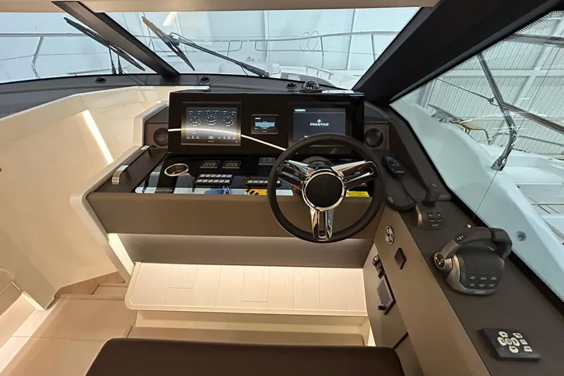  Yacht Photos Pics Helm of 2026 Prestige F4.9 yacht with modern controls and navigation displays.