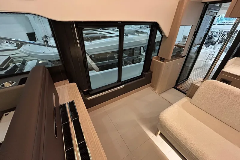  Yacht Photos Pics Luxurious interior of 2026 Prestige F4.9 yacht with modern seating and large windows.