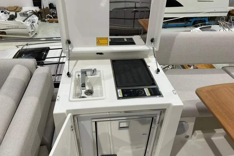  Yacht Photos Pics Prestige F4.9 yacht interior with kitchenette, sink, and grill, 2026 model.