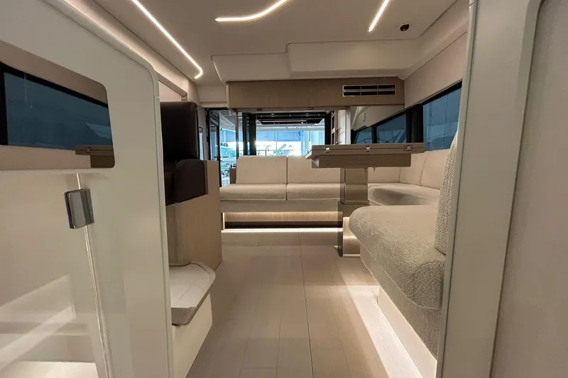  Yacht Photos Pics Luxurious interior of 2026 Prestige F4.9 yacht with modern seating and ambient lighting.