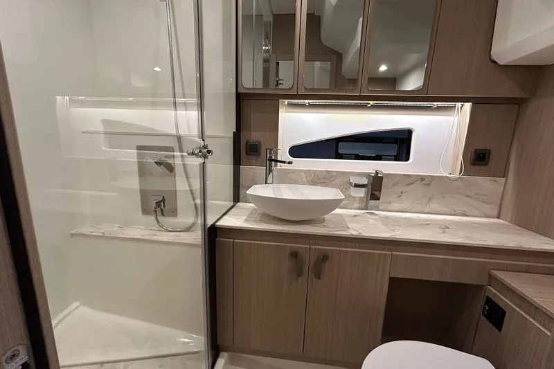  Yacht Photos Pics Luxurious bathroom in 2026 Prestige F4.9 yacht with modern fixtures and elegant design.