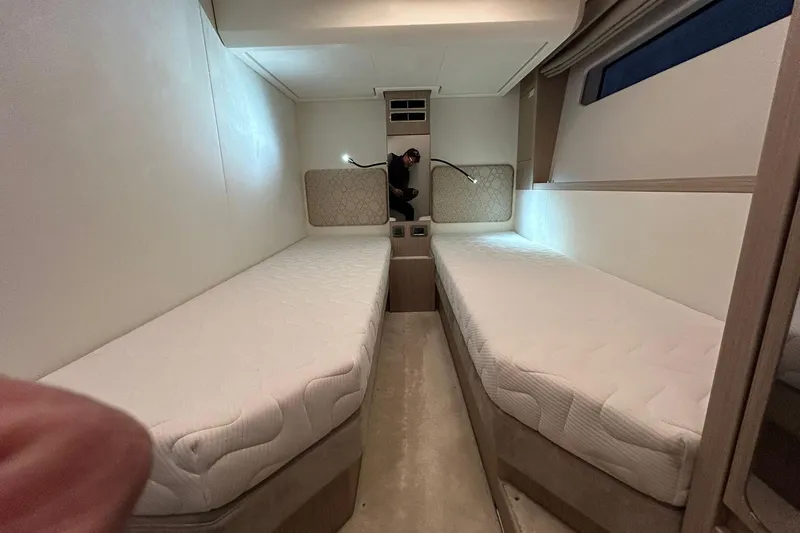  Yacht Photos Pics 2026 Prestige F4.9 interior with twin beds and modern lighting.