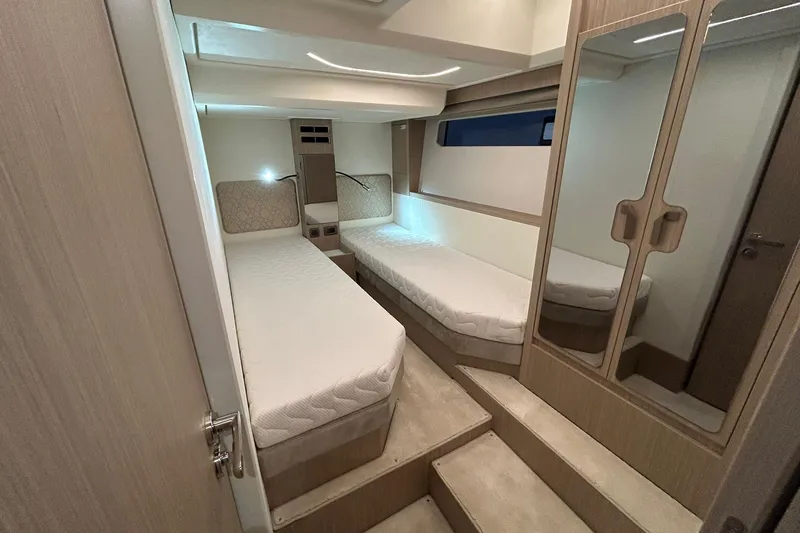  Yacht Photos Pics Luxurious cabin interior of 2026 Prestige F4.9 yacht with twin beds and modern design.