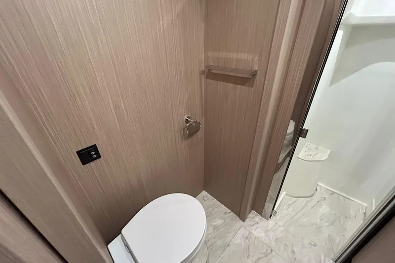  Yacht Photos Pics Modern bathroom in 2026 Prestige F4.9, featuring sleek design and marble flooring.