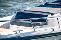 Nimbus T11 2022 boat with cushioned seating on deck, cruising on water.