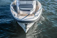 2022 Nimbus T11 boat cruising on open water, showcasing sleek design and spacious deck.