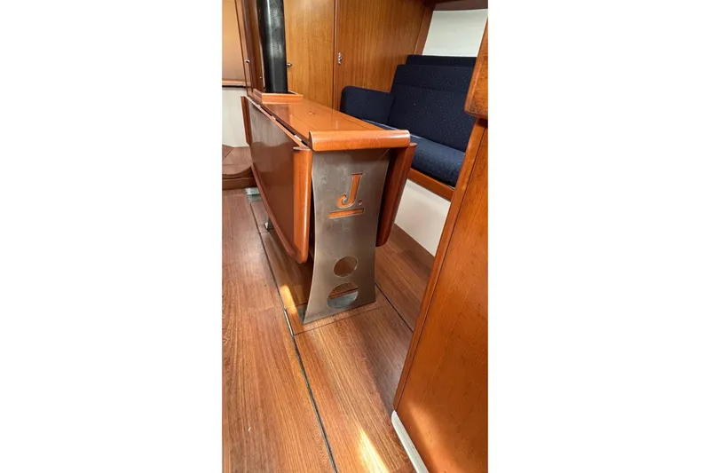 Tarahumara Yacht Photos Pics Interior of 2008 J Boats J/122 sailboat, featuring wooden flooring and seating.