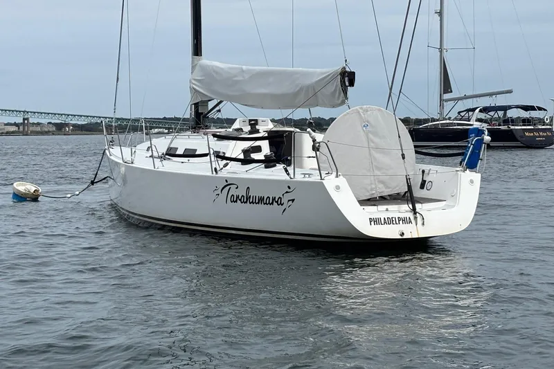Tarahumara Yacht Photos Pics 2008 J Boats J/122 sailboat named Tarahumara moored in a harbor.