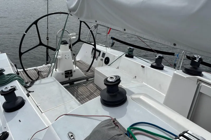 Tarahumara Yacht Photos Pics 2008 J Boats J/122 sailboat cockpit with steering wheel and winches on calm water.
