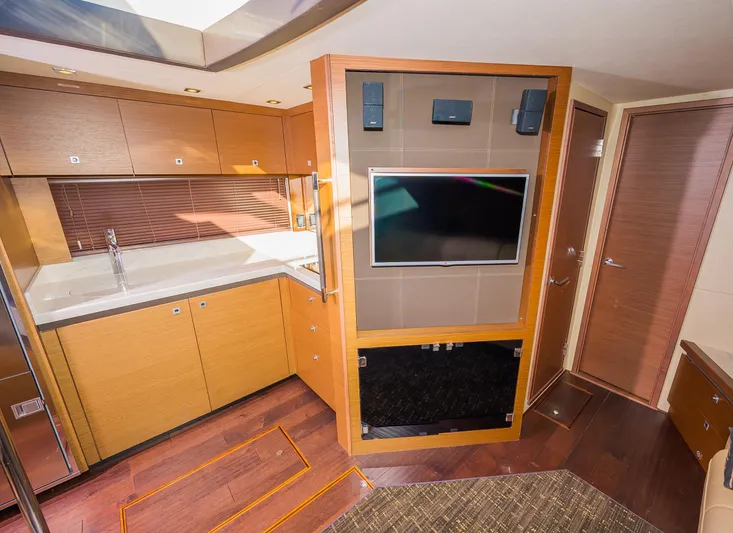 Trinity Yacht Photos Pics 2015 Sea Ray Sundancer 510 interior with modern kitchen and entertainment center.