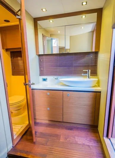 Trinity Yacht Photos Pics Modern bathroom in 2015 Sea Ray Sundancer 510 yacht with wooden cabinetry and vessel sink.