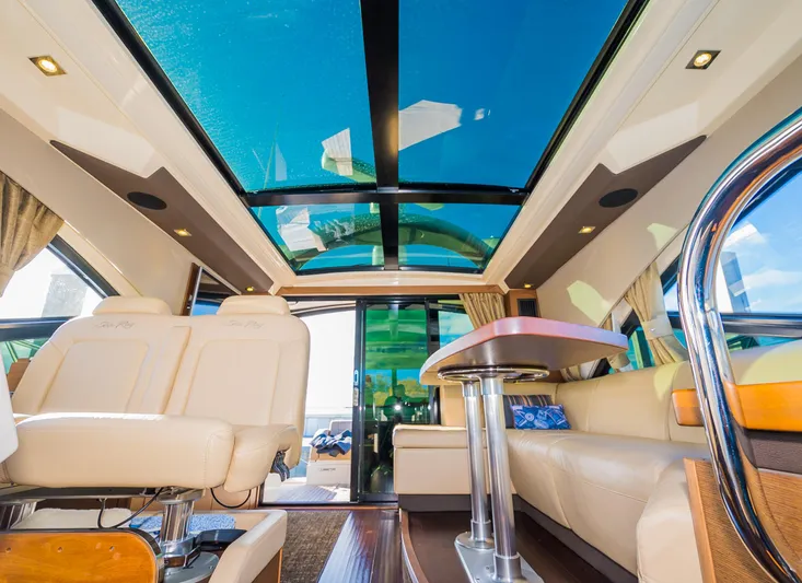 Trinity Yacht Photos Pics Interior of 2015 Sea Ray Sundancer 510 yacht with luxurious seating and panoramic windows.