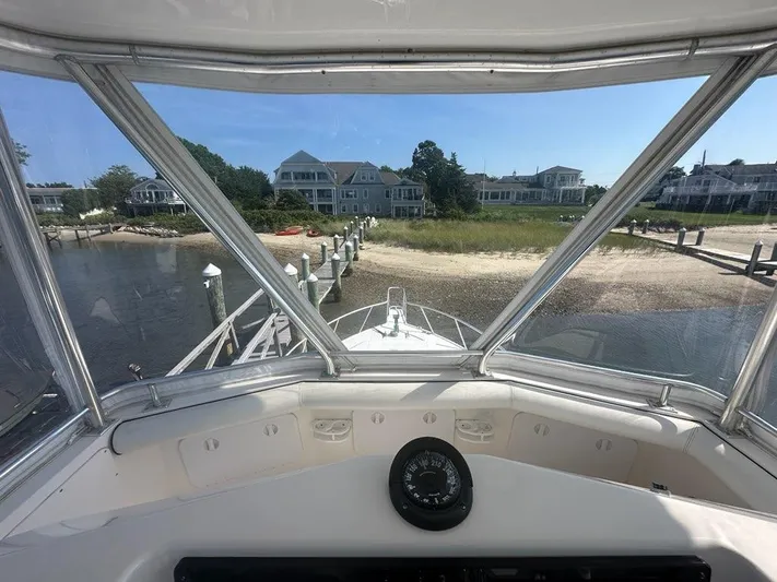 Lola Yacht Photos Pics View from 2005 Cabo 35 Flybridge overlooking coastal homes.