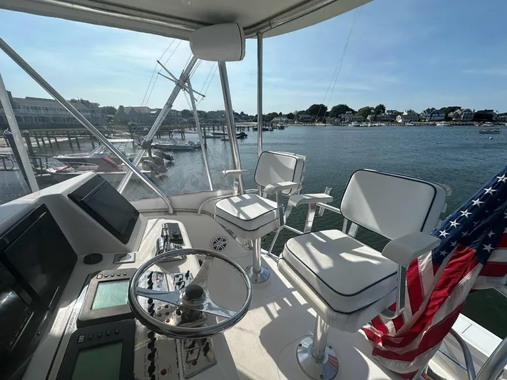 Lola Yacht Photos Pics 2005 Cabo 35 Flybridge overlooking the harbor.