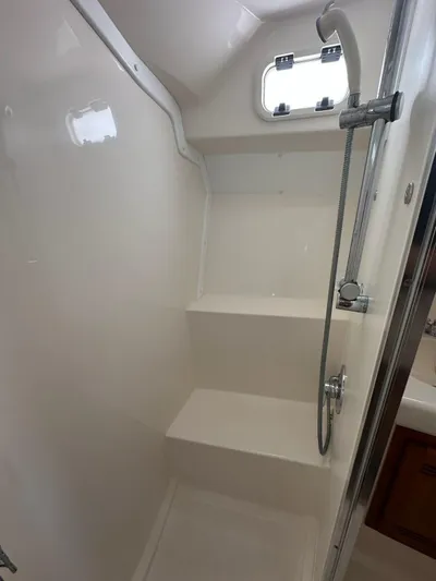 Lola Yacht Photos Pics Shower in 2005 Cabo 35 Flybridge boat with window.