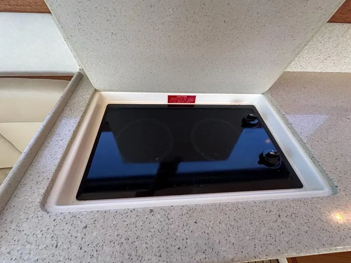 Lola Yacht Photos Pics Cabo 35 Flybridge 2005 kitchen area with built-in cooktop.