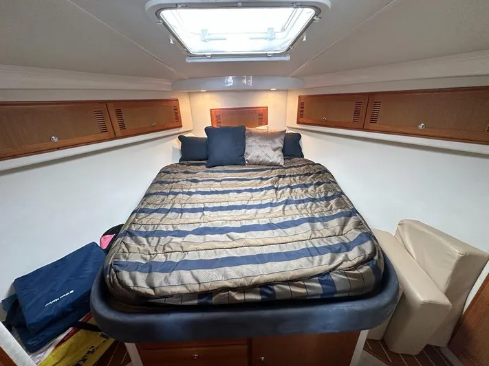 Lola Yacht Photos Pics Interior of 2005 Cabo 35 Flybridge with cozy bed.