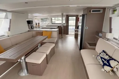 Joy Yacht Photos Pics Luxurious interior of 2021 Bali 5.4 catamaran with modern seating and dining area.