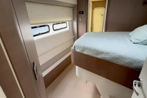 Joy Yacht Photos Pics Interior of 2021 Bali 5.4 yacht cabin with bed and window.