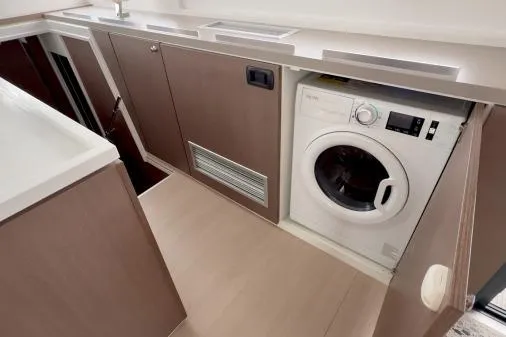 Joy Yacht Photos Pics 2021 Bali 5.4 interior with built-in washing machine and modern cabinetry.