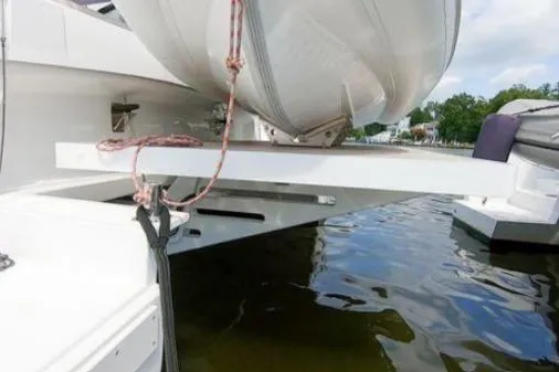 Joy Yacht Photos Pics 2021 Bali 5.4 yacht with dinghy on davit over water.