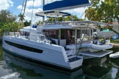 Joy Yacht Photos Pics 2021 Bali 5.4 catamaran docked, featuring spacious deck and modern design.