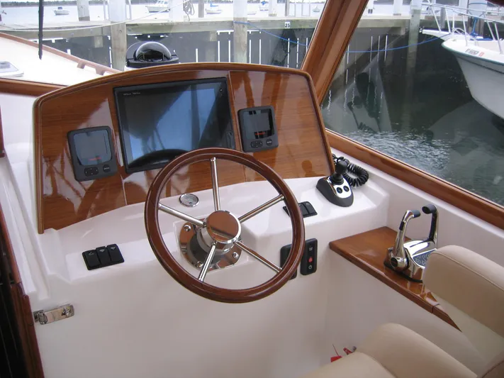 Shelter Island Yacht Photos Pics Helm of 2026 CH Marine Shelter Island Runabout with modern controls and navigation display.
