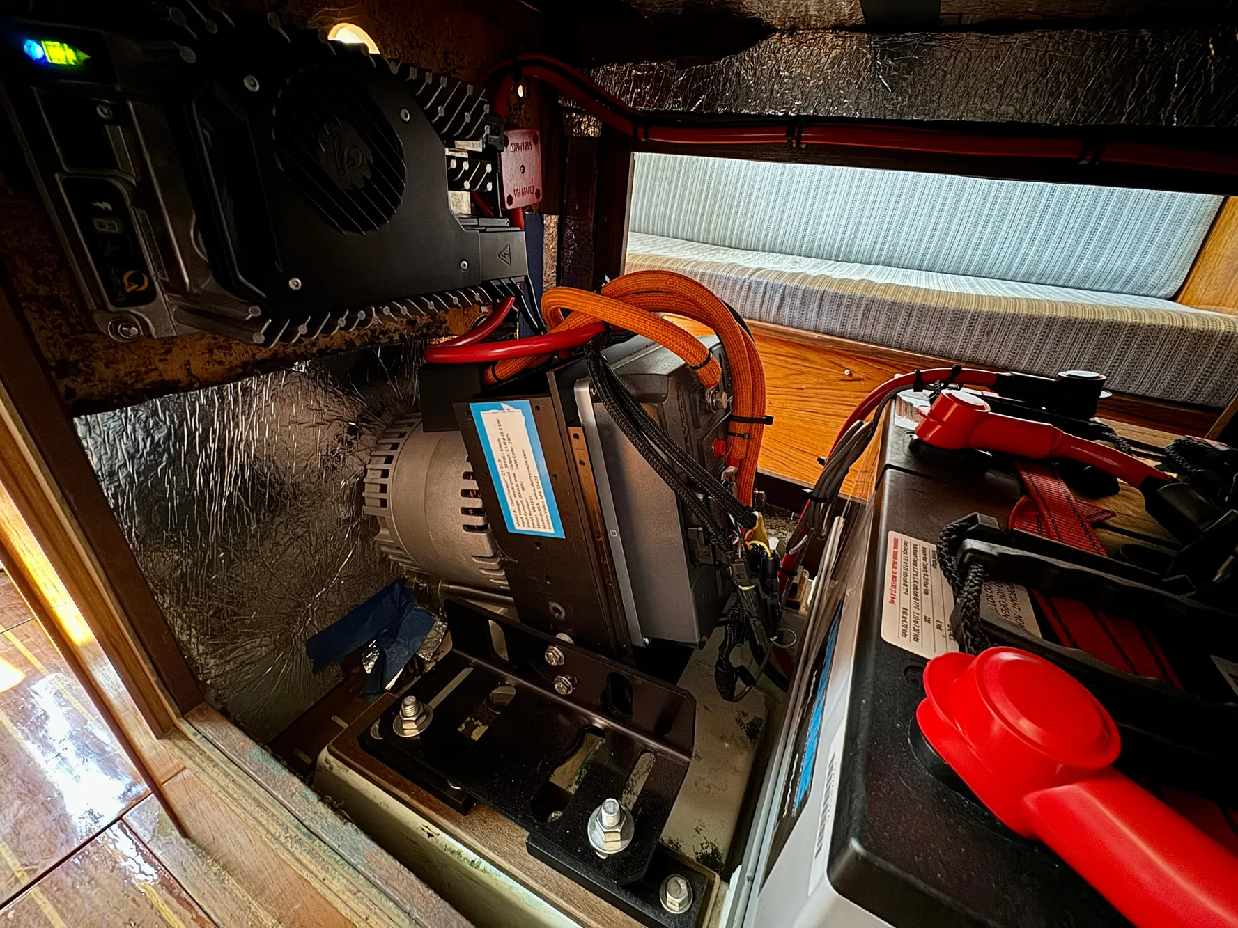 Engine compartment of a 1988 Beneteau First Class 12 sailboat, showcasing mechanical components.