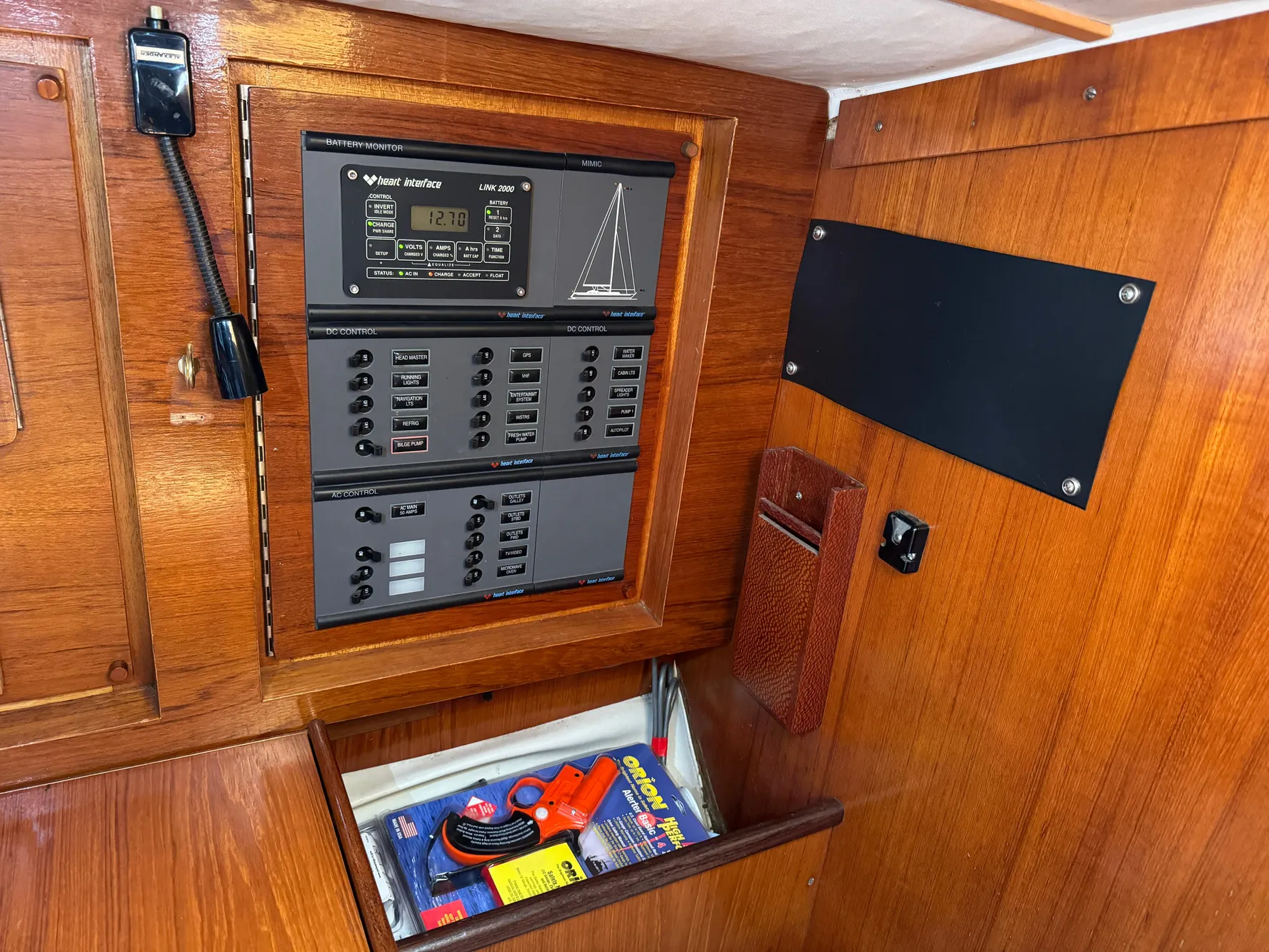Electrical panel inside 1988 Beneteau First Class 12 sailboat with wooden interior.